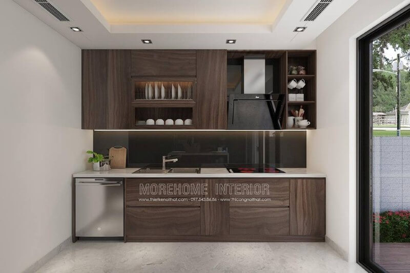 Mẫu tủ bếp với đường vân độc đáo cùng gỗ tối màu đã tạo nên không gian bếp hiện đại sang trọng. Thiết kế tủ bếp nhà phố sang trọng